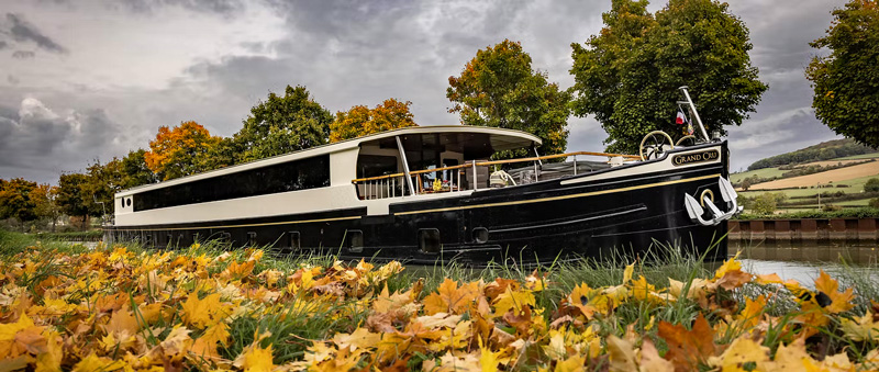 French Hotel Barge Grand Cru cruising the Canal de Bourgogne in Burgundy France