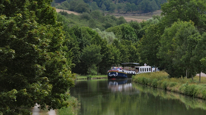 French Hotel Barge L'Impressionniste Cruising the Canal de Bourgogne in Burgundy, France
