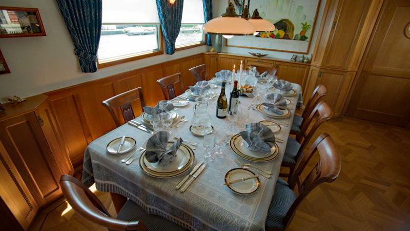 Enjoy fine dining aboard Hotel Barge La Nouvelle Etoile