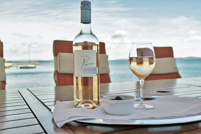 Wine being served on deck of Athos