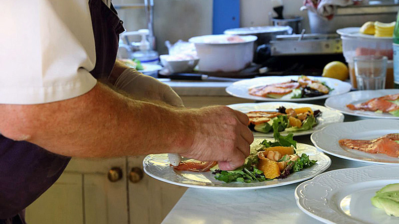 Chef preparing a meal aboard French Hotel Barge Rosa in southwest France