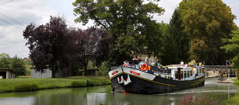 French Hotel Barge Rosa leaving lock.