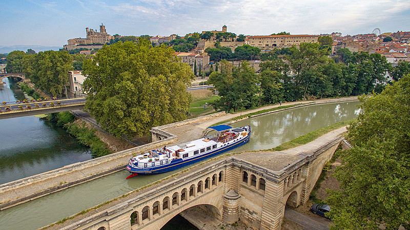 French Hotel Barge Anjodi cruising the aqueduct over the River Orb