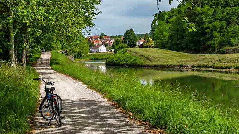 French Hotel Barge Finesse with bike on towpath