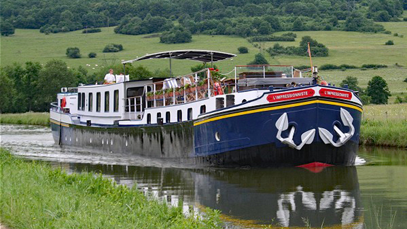 French Hotel Barge L'Impressioniste cruising the Canal de Bourgogne in Burgundy France