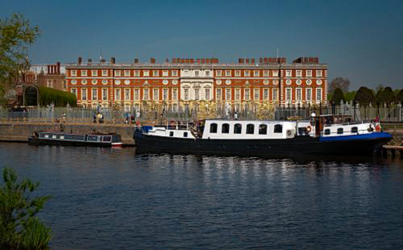 English Hotel Barge Magna Carta moored outside of Hampton Court.